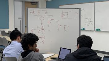 Students studying circuits